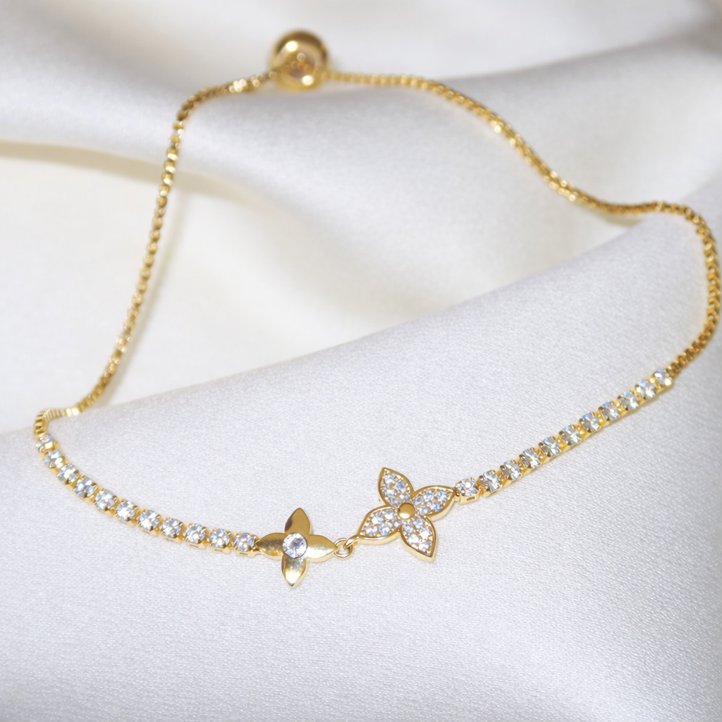 Bracelet doré en acier inoxydable orné de fleurs scintillantes | Emmanuelle