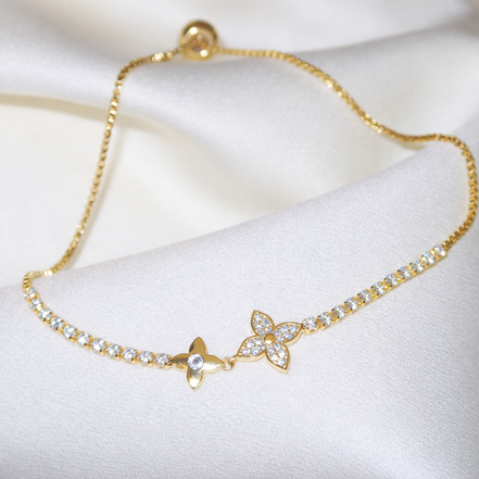 Bracelet doré en acier inoxydable orné de fleurs scintillantes | Emmanuelle